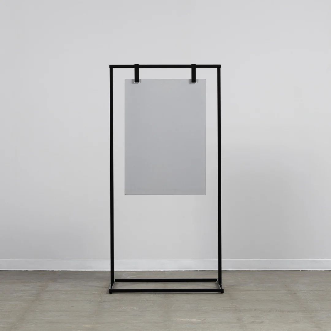 a black metal frame with a white square on it