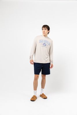 a man standing in front of a white background