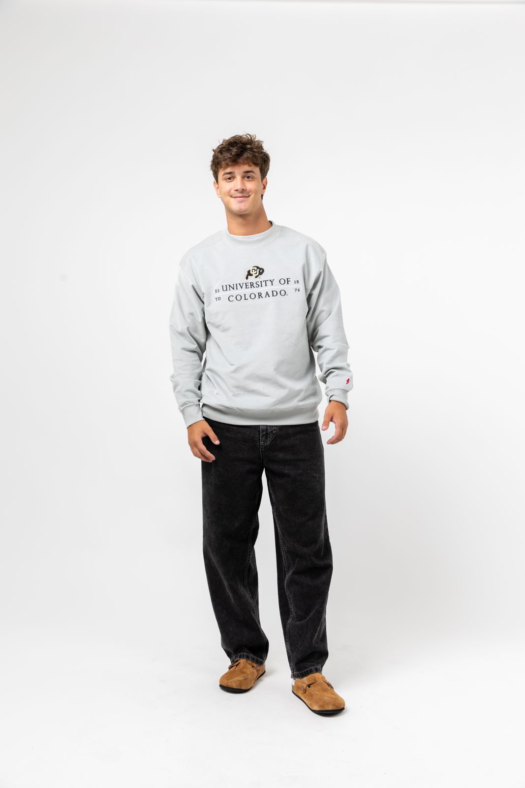 a man standing in front of a white background