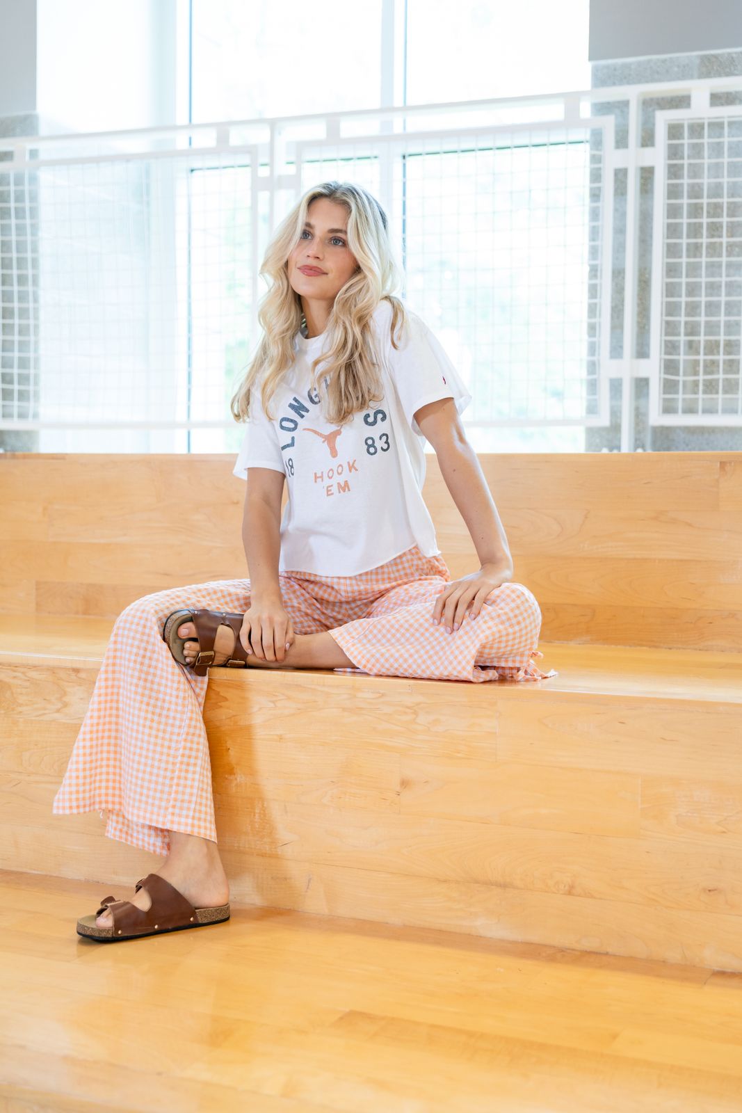 a woman sitting on the steps of a building