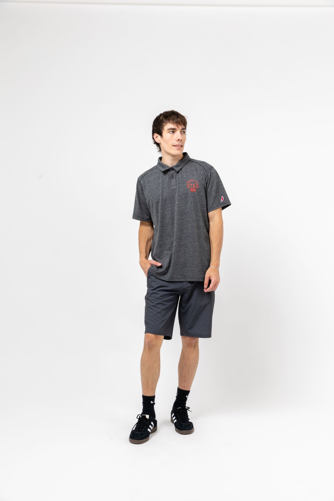 a man standing in front of a white background