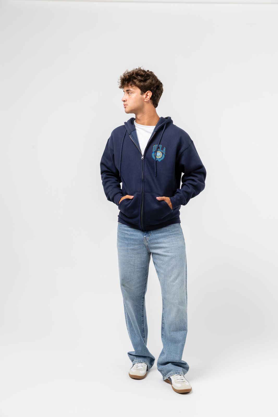 a man standing with his hands in his pockets