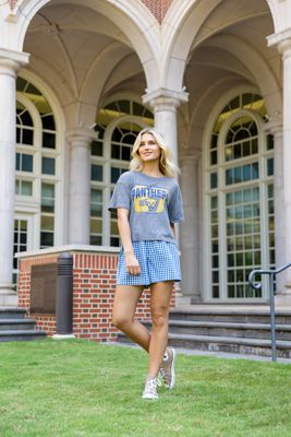 a woman standing in front of a building