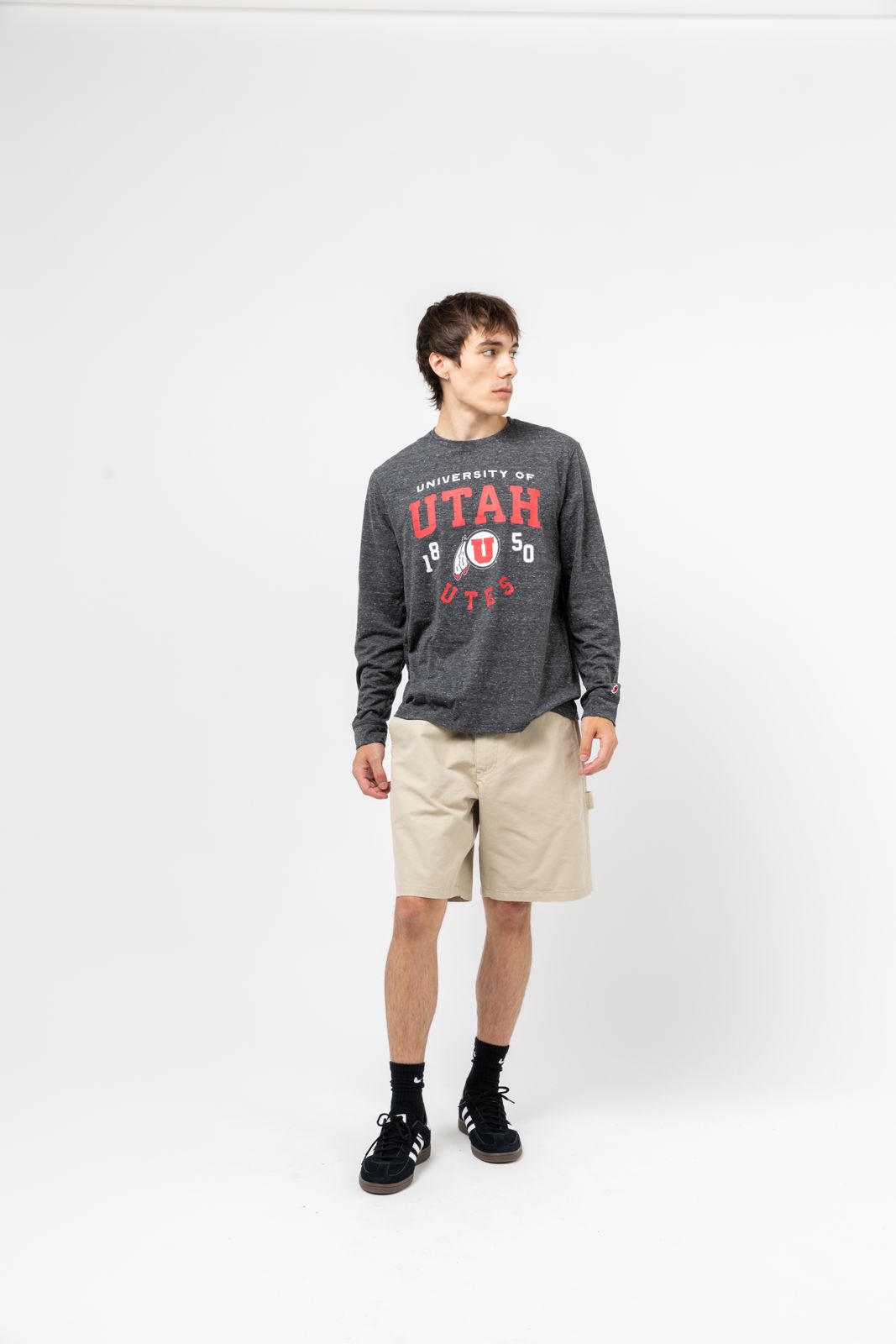 a man standing in front of a white background