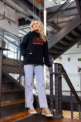 a woman is standing on a stair case