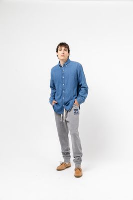 a man standing in front of a white background