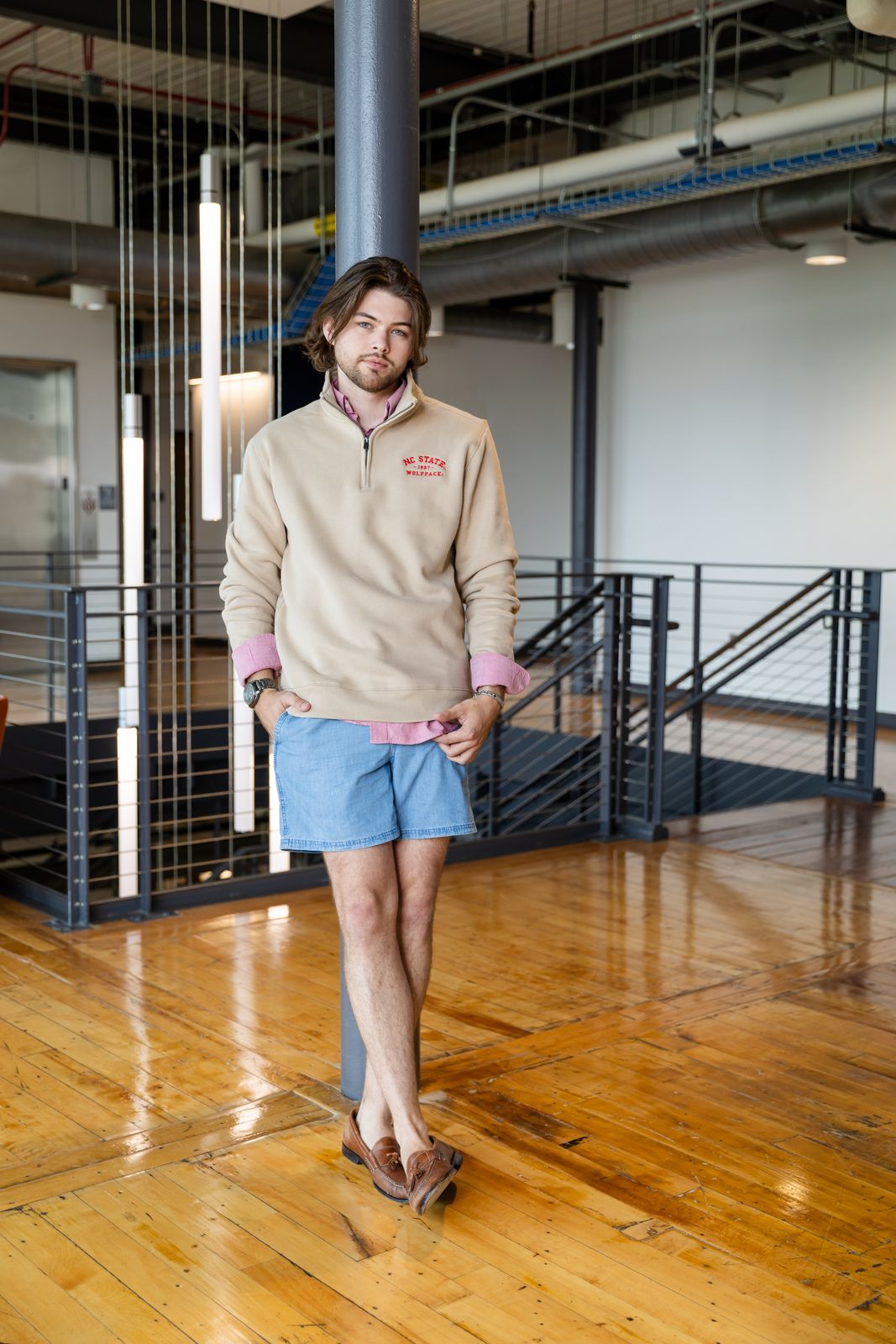 a man standing on a hard wood floor