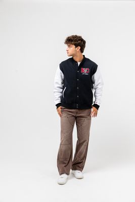 a man standing in front of a white background