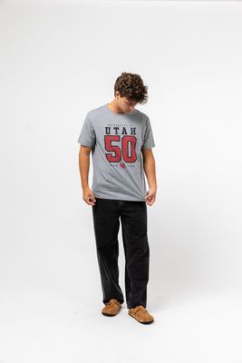 a man standing in front of a white background