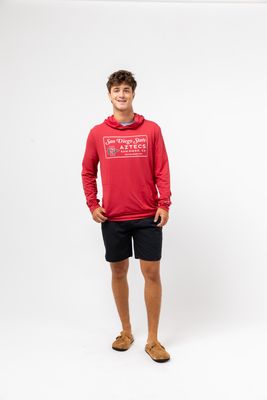 a young man in a red hoodie poses for a picture