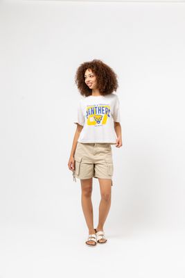 a woman standing in front of a white background