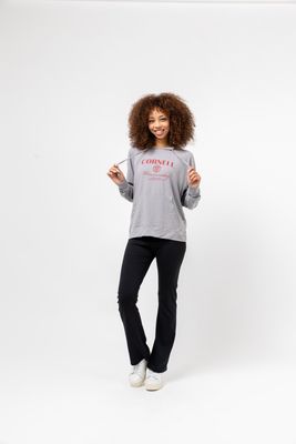 a woman standing in front of a white background