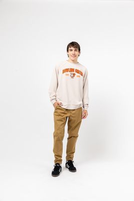 a young man standing in front of a white background