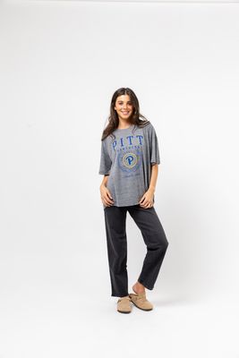 a woman standing in front of a white background