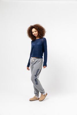 a woman standing in front of a white background