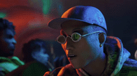 a man wearing a hat and glasses in a dark room