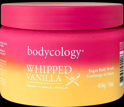 a jar of whipped vanilla body scrub on a black background