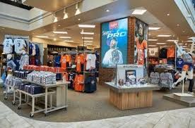 the inside of a sports store with many items on display