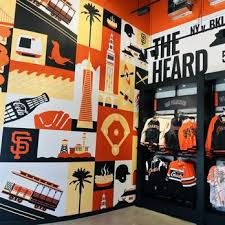 an orange and white wall with a bunch of different items on it