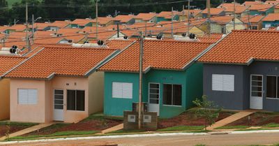 a row of houses with orange tiled roofs