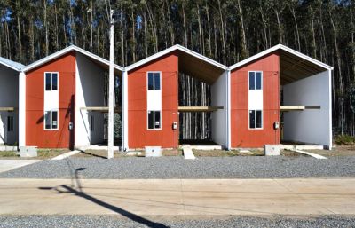 a row of red and white buildings sitting next to each other