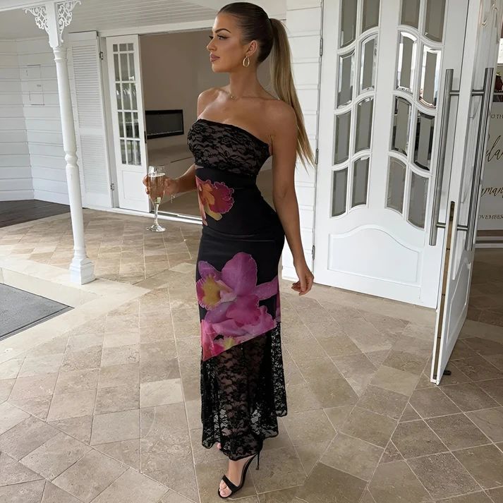 a woman in a black and pink dress