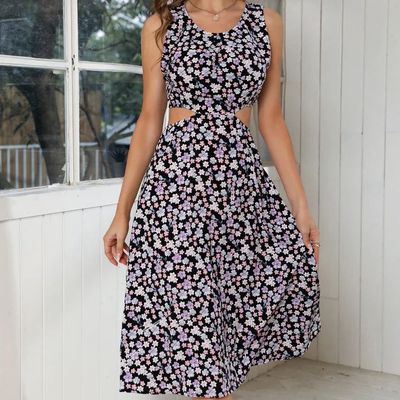 a woman wearing a black and white floral dress