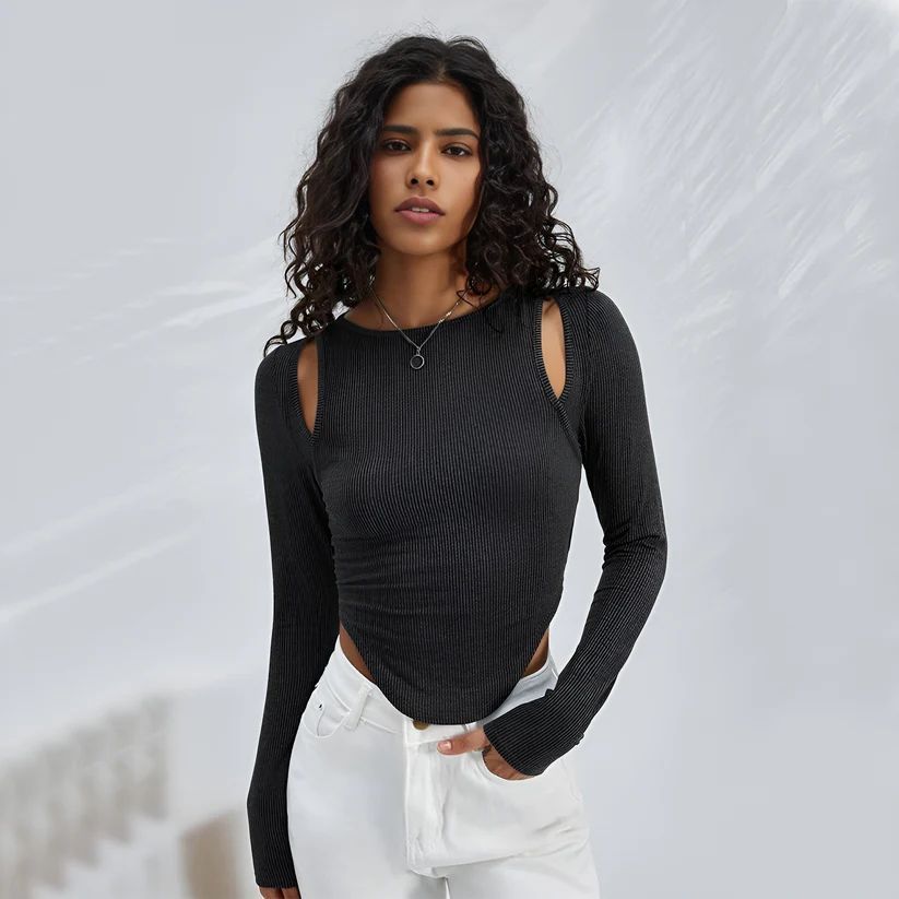 a woman wearing a black top and white pants