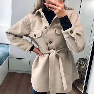 a woman taking a selfie in a mirror