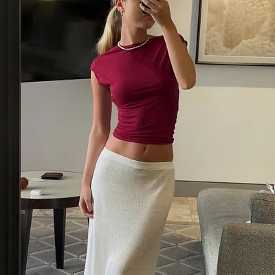 a woman taking a selfie in a room