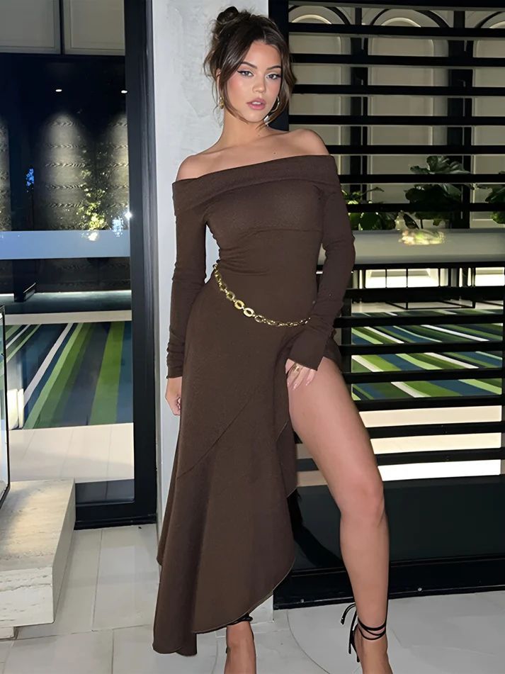 a woman in a brown dress posing for a picture