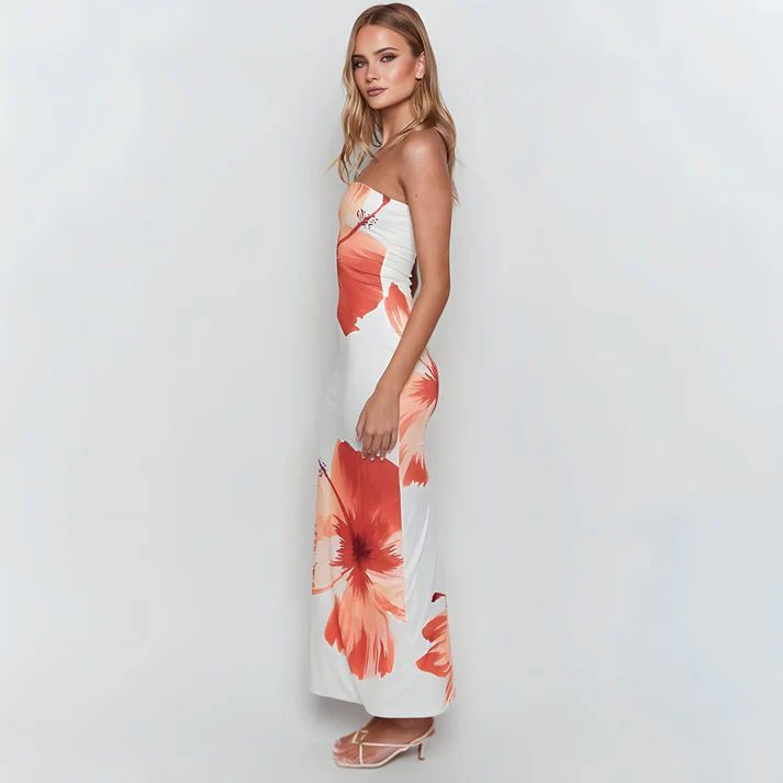 a woman in a white and orange dress