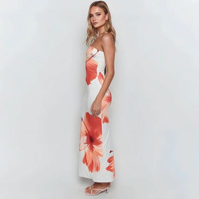 a woman in a white and orange dress