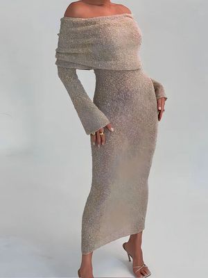 a woman in a dress posing for a picture