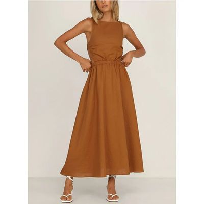 a woman is wearing a brown dress