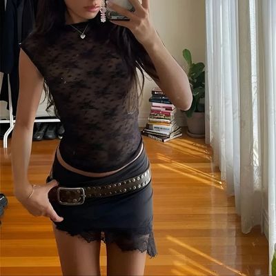 a woman taking a picture of herself in a mirror