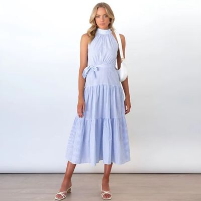 a woman wearing a blue and white striped dress