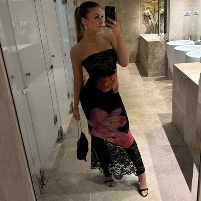 a woman taking a selfie in a bathroom