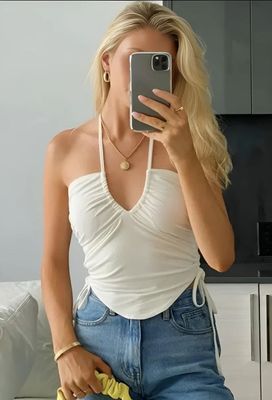 a woman taking a picture of herself in a mirror