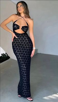 a woman in a black dress posing for a picture