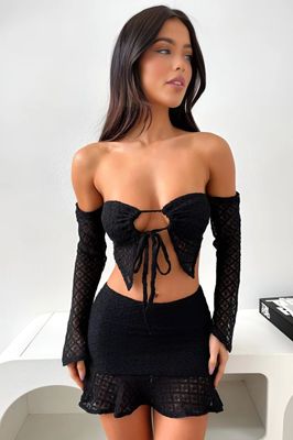 a woman in a short skirt and top