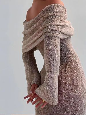 a mannequin wearing a dress with a long sleeve