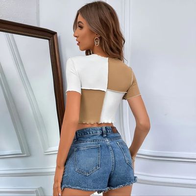 a woman standing in front of a mirror