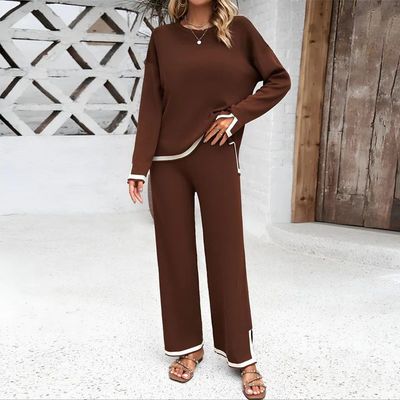 a woman wearing a brown and white outfit