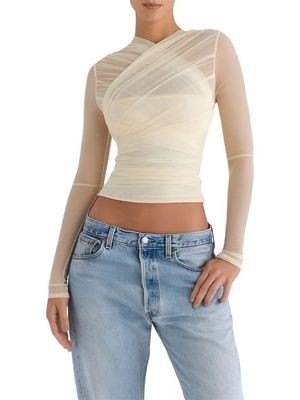 a woman wearing a white top and jeans
