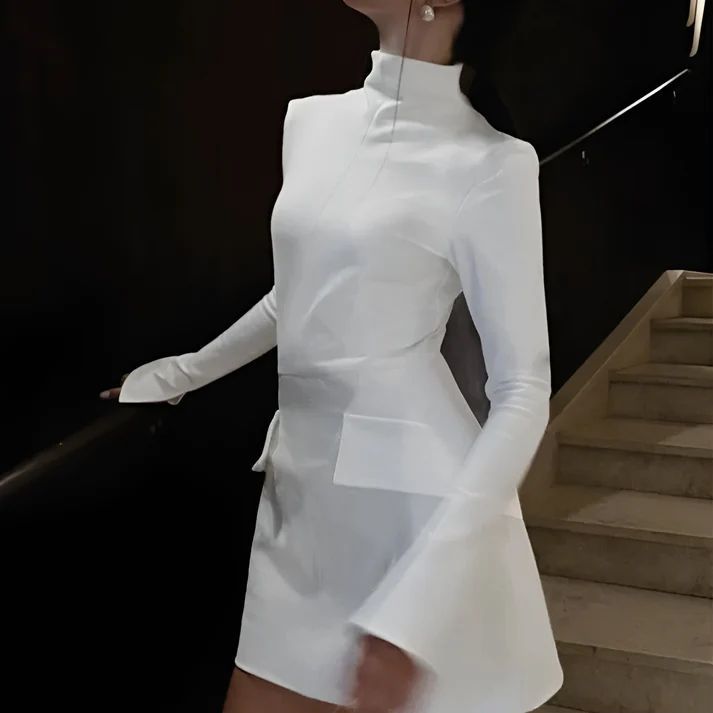a woman in a white dress is holding an umbrella
