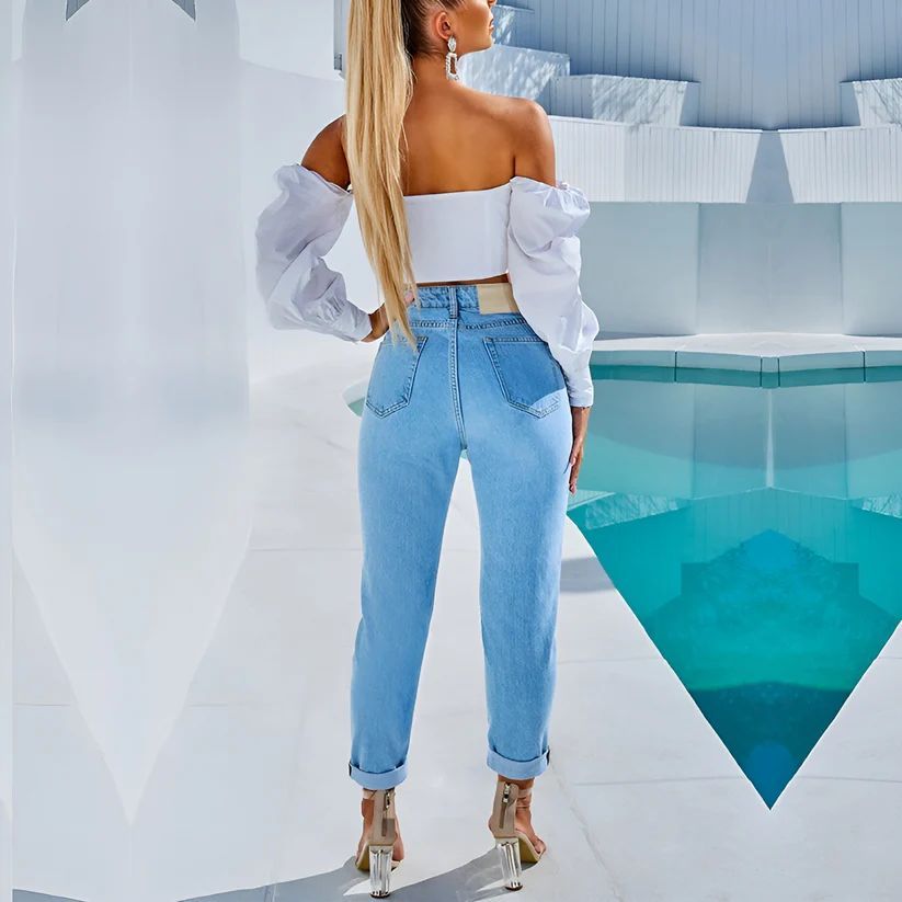a woman standing in front of a swimming pool