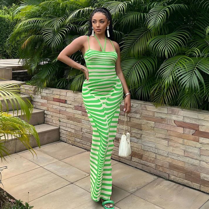 a woman in a green and white striped dress