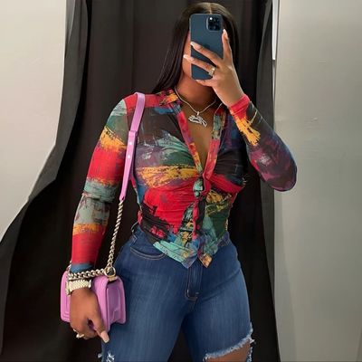 a woman taking a picture of herself in a mirror