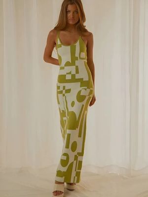 a woman standing in front of a white curtain